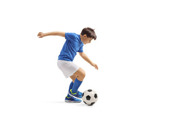 Boy in a blue jersey playing football