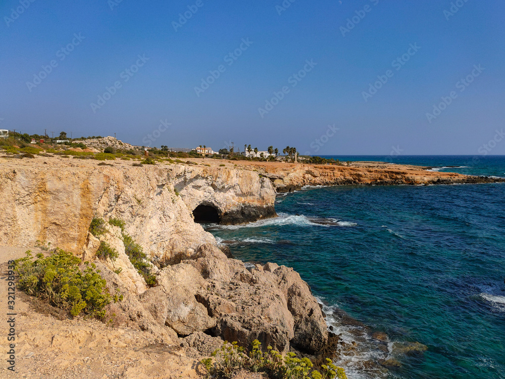 View to sea cave and stone cliffs near 