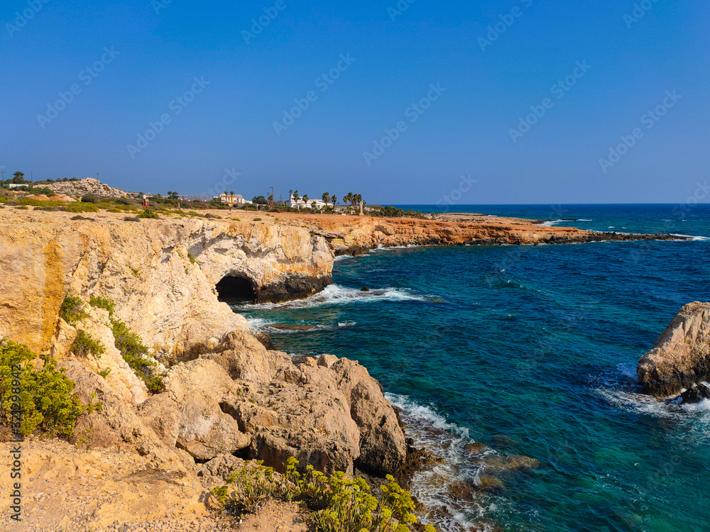 View to sea cave and stone cliffs near 