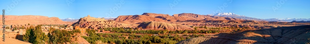 Bright landscape of Morocco, breathtaking curves of mountains, stunning combination of hills & farm land,inadvertent distribution of houses & huts, raw impression of pure nature.