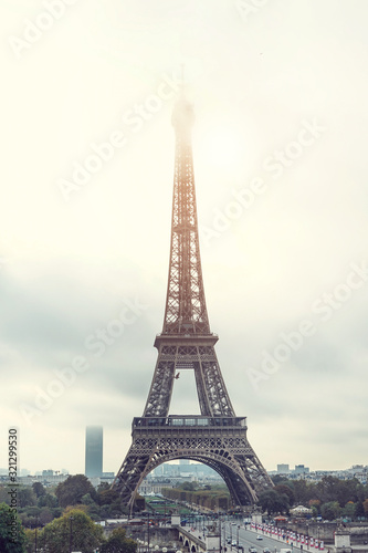 Postcard with a view of the Eiffel Tower in the fog
