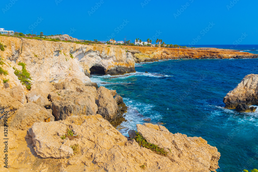 View to sea cave and stone cliffs near 