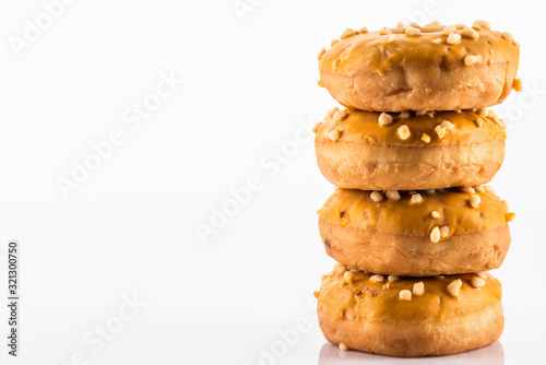 Salted Caramel Donut or Doughnuts on White Reflective Background with Copy Space