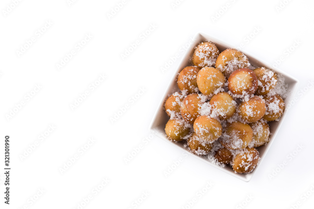 Carnival fritters or buñuelos de viento in bowl for holy week isolated on whiop view. Copy spacete background. T Carnival fritters or buñuelos de viento in bowl for holy week isolated on whiop view. Copy spacete background. T