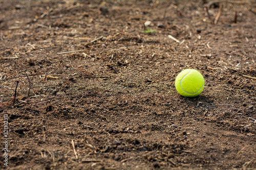 tennis ball is discarded on the ground. © sema_srinouljan
