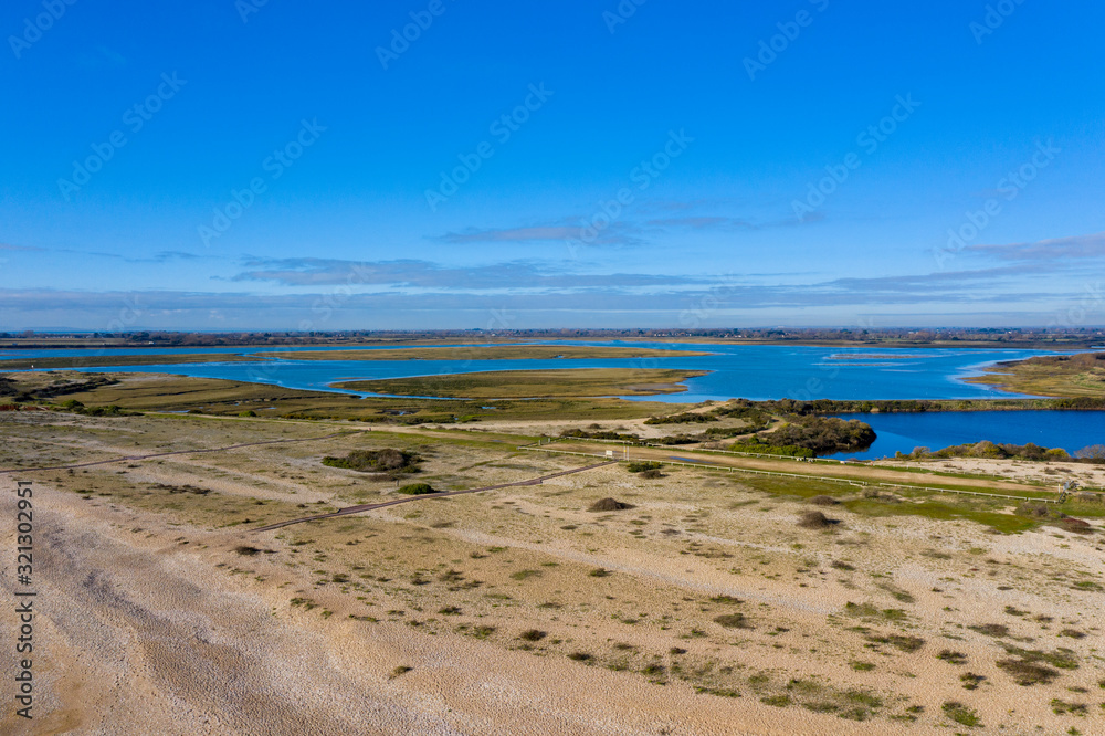 Pagham Harbour nature reserve from the beach aerial photo on a beautiful sunny winters day. 