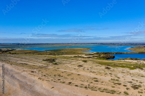 Pagham Harbour nature reserve from the beach aerial photo on a beautiful sunny winters day. 