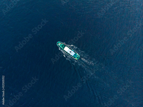 Oil chemical tanker sails blue sea fog. Aerial top view © Parilov