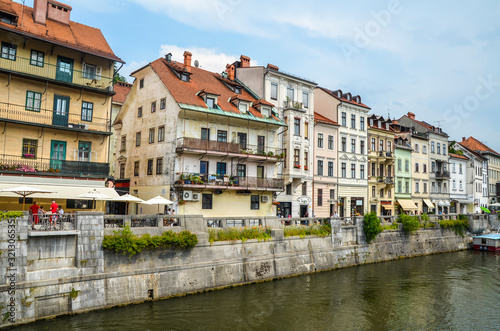Panorama of old town Ljubljana, Slovenia, with numerous bars and restaurants at waterfront of Ljubljanica river.