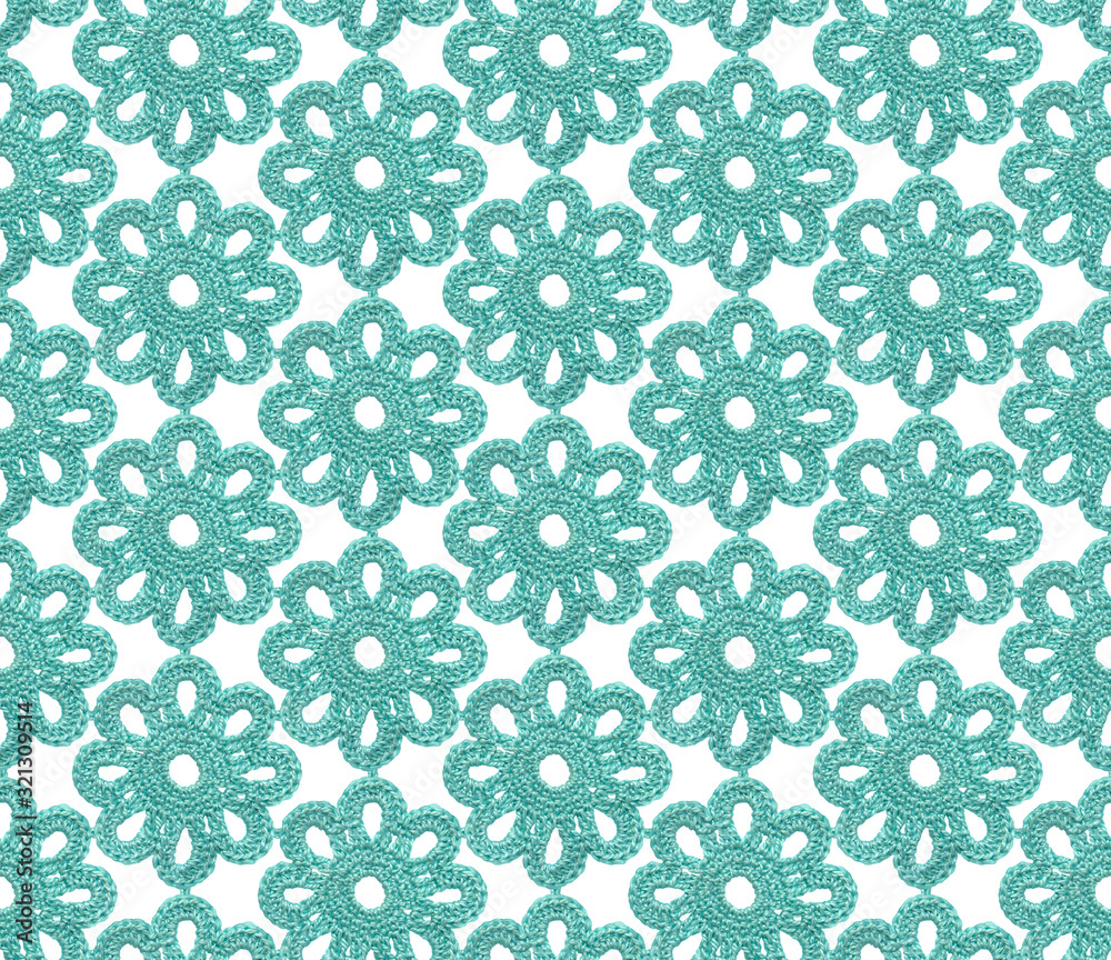 Crochet irish lace seamless pattern. The canvas is knitted with blue yarn.