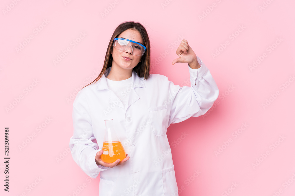 Young chemical woman isolated feels proud and self confident, example to follow. Young chemical woman isolated feels proud and self confident, example to follow.