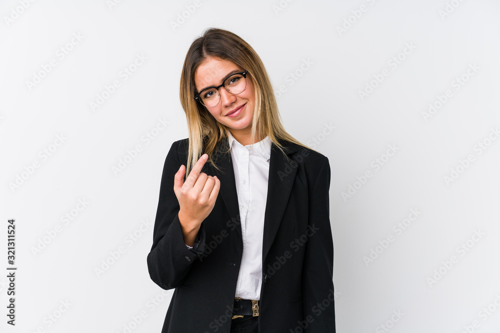 Young business caucasian woman pointing with finger at you as if inviting come closer. Young business caucasian woman pointing with finger at you as if inviting come closer.