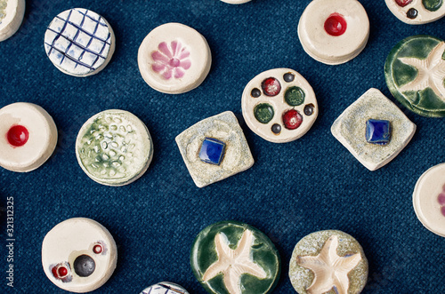 handmade ceramic jewelry on a blue denim surface