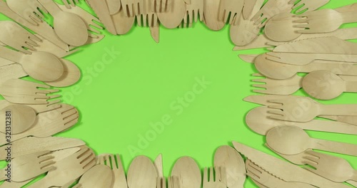 Stop motion Disposable appliance background for a meal of wood. Eco concept.