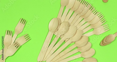 Stop motion Disposable appliance background for a meal of wood. Eco concept.