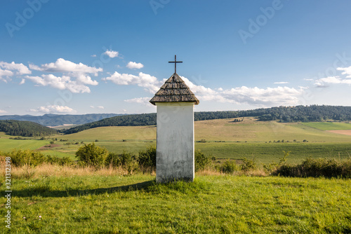 Canvas Print Traditional little roadside chapel in rural area of Spis (Presov) region in Slov