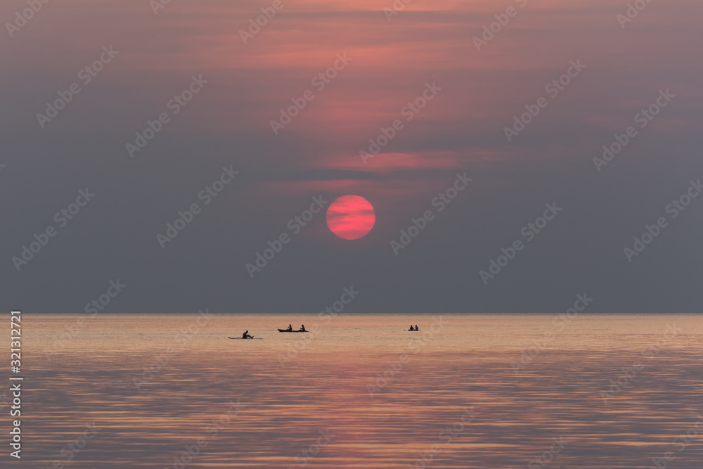 Stand up paddle boarding on quiet sea Stand up paddle boarding on quiet sea