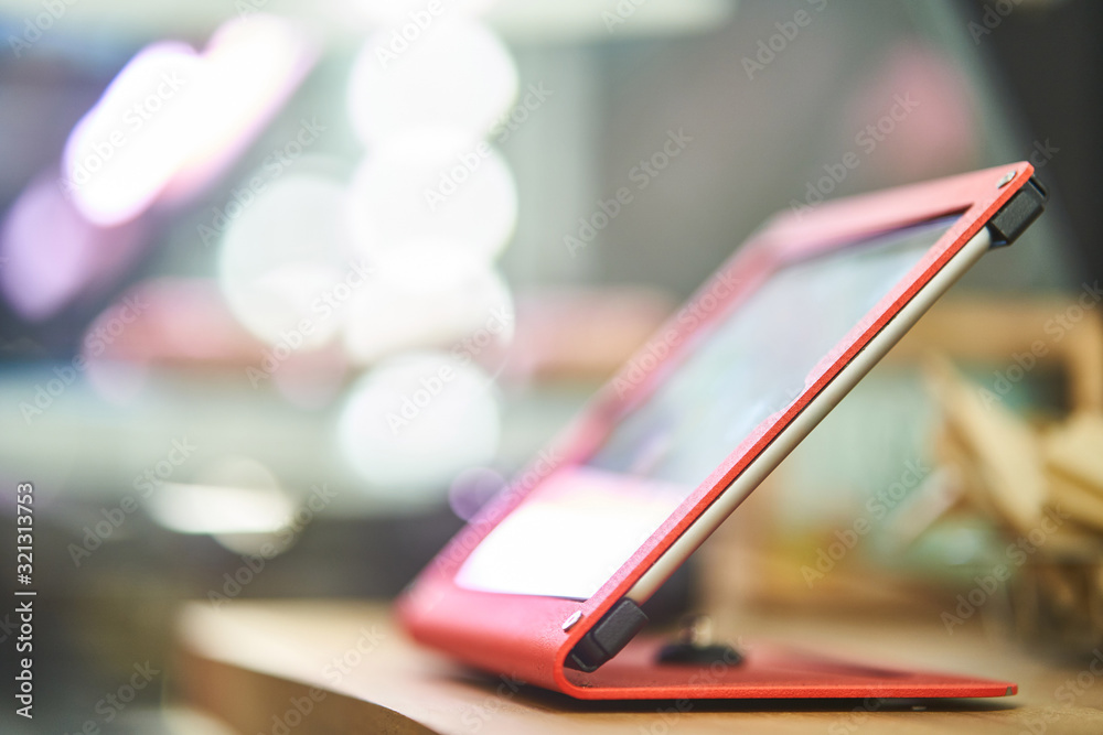 Cashier counter. Tablet with CRM system. close-up Cashier counter. Tablet with CRM system. close-up