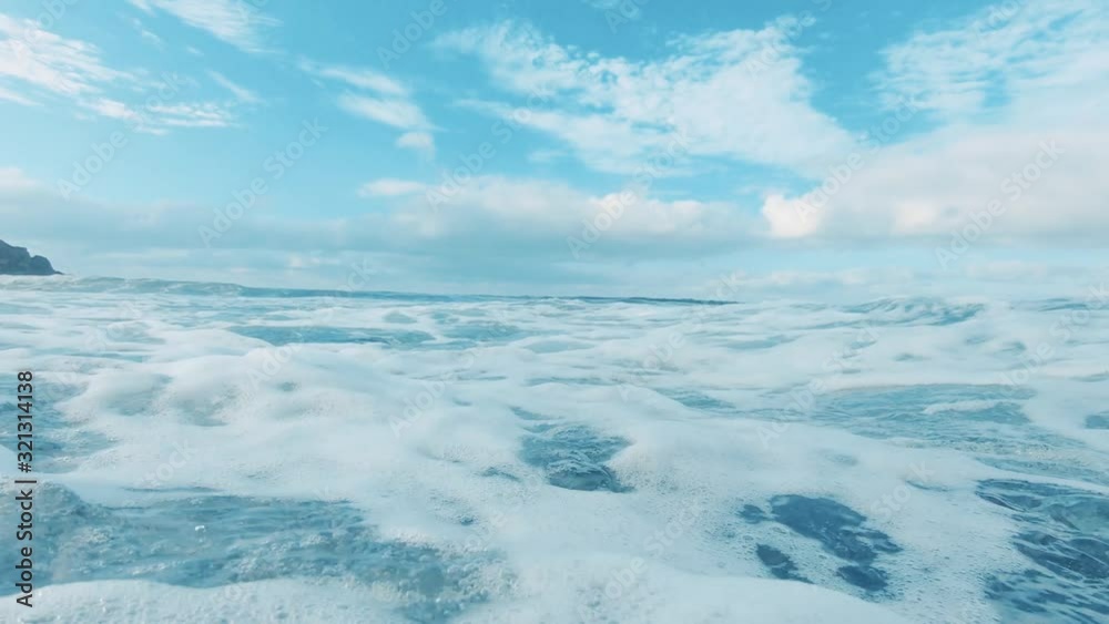 Big ocean wave crashed and make underwater bubbles with sunlight through water surface, natural slow motion underwater scene Big ocean wave crashed and make underwater bubbles with sunlight through water surface, natural slow motion underwater scene