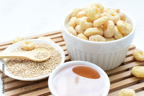 Quinoa cereal, accompanied by seeds and honey