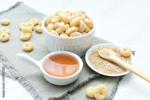 Quinoa cereal, accompanied by seeds and honey