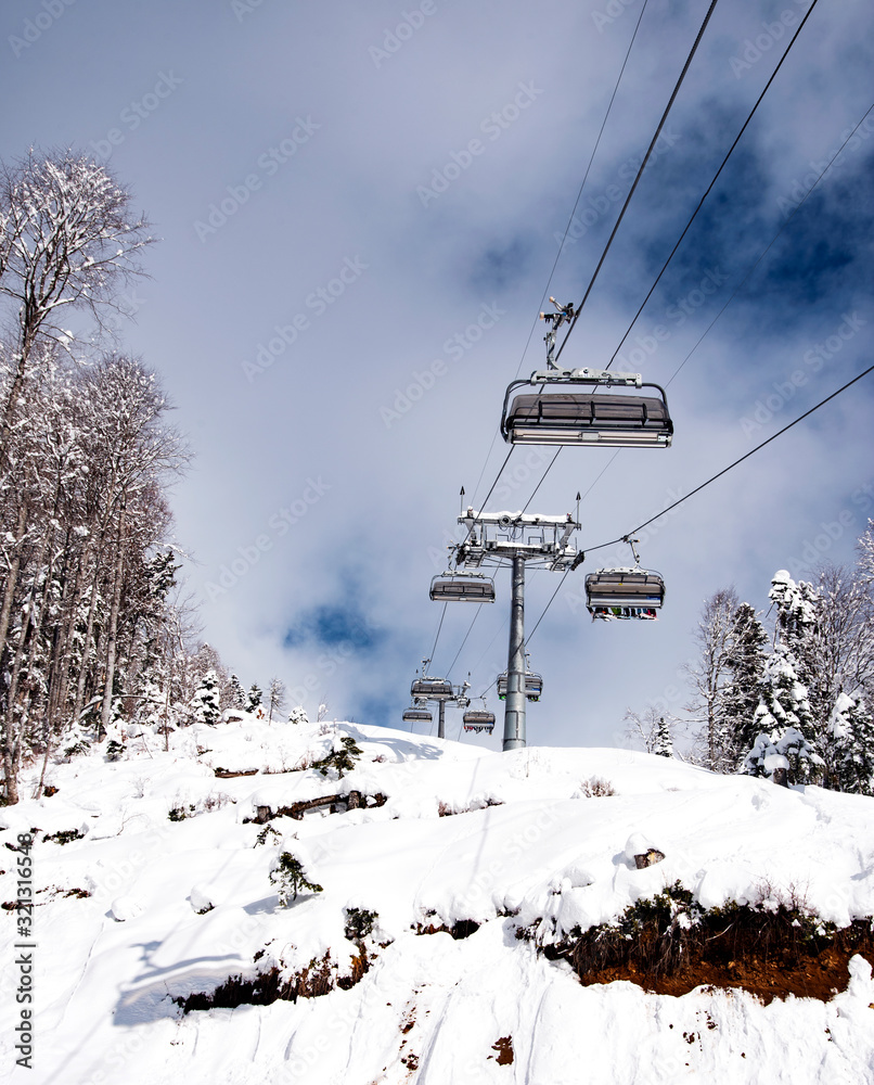 mountain ski resort Rosa Khutor in Sochi.  Winter sunny day with cloudy .