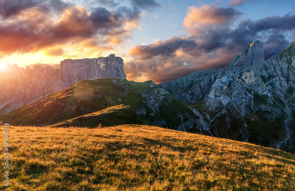 Fototapeta premium Unsurpassed sunrise in the mountains. Dramatic sunset in dolomites alp mountain from peak under sunlight. Amazing nature landscape. Picture of wild area. wonderful picturesque Scene