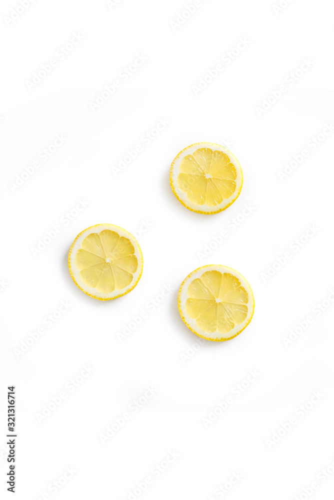 Top view of fresh organic lemon slices isolated on a white background Top view of fresh organic lemon slices isolated on a white background