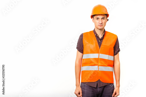 smiling worker in protective uniform and protective helmet isolated on white