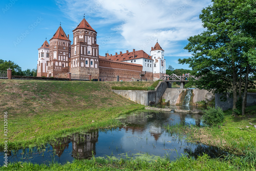 Mir Castle Complex in Belarus with waterfall (water mill) on river Mir Castle Complex in Belarus with waterfall (water mill) on river