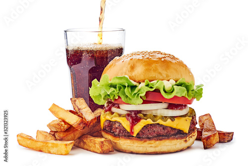 Hamburger, french fries and drink on white
