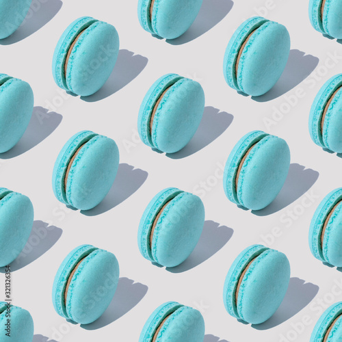 Abstract pattern with blue macaroons on white background with shadows. Seamle...