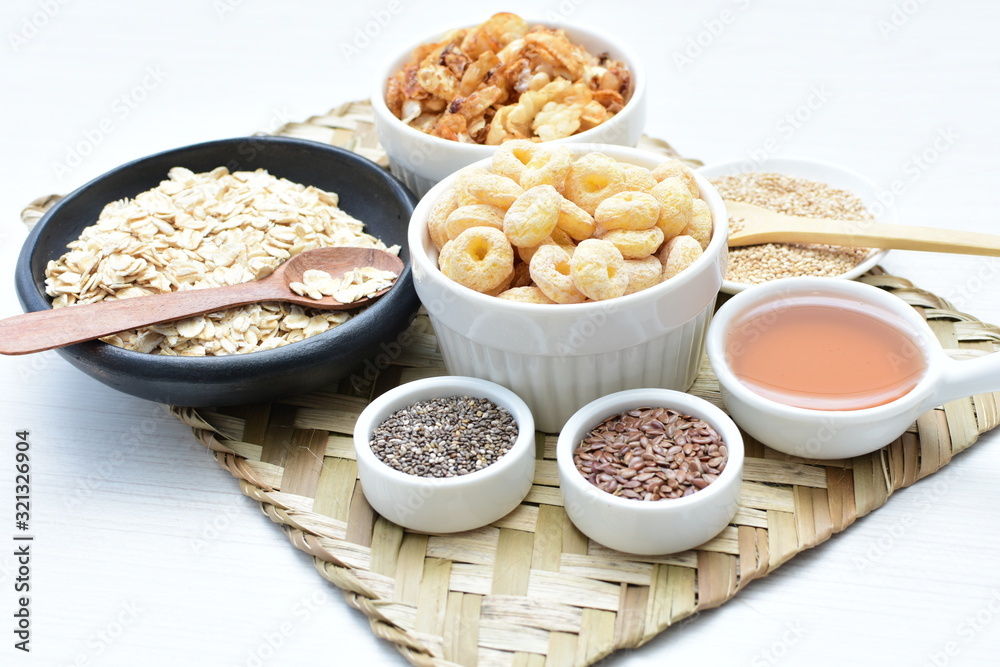Granola mix accompanied by seeds and honey Granola mix accompanied by seeds and honey