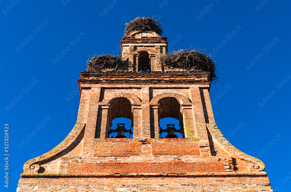 Storks' nests on the bell tower of the 