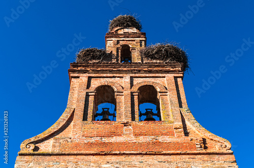 Storks' nests on the bell tower of the "Iglesia de Purificación" church in Hospital de Órbigo, little village located in the province of León, Castile and León, Spain. 