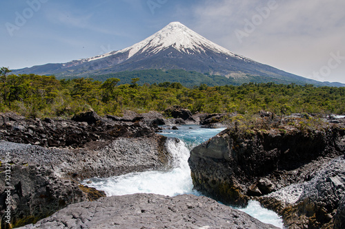 volcano motorboat boat osorno cabulco villarica chile volcan thaw river snow on top chile puerto varas puerto mont pucon villarica osorno blue water blue sky sunset lagun photo Jovani Prochnov photo