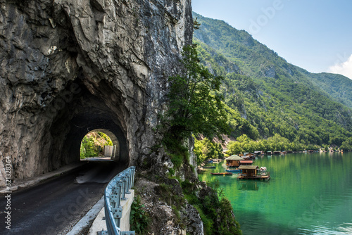 Houseboats (housing on raft) and tunnel in National Park Tara in Serbia  photo