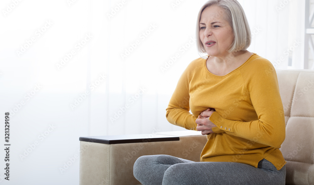 Portrait of middle aged woman having heart attack Portrait of middle aged woman having heart attack