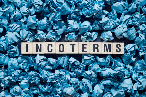 Incoterms word concept on cubes photo