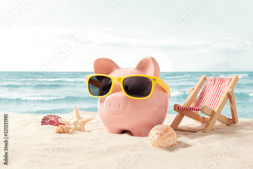 Piggy bank on vacation. Finance and travel concept