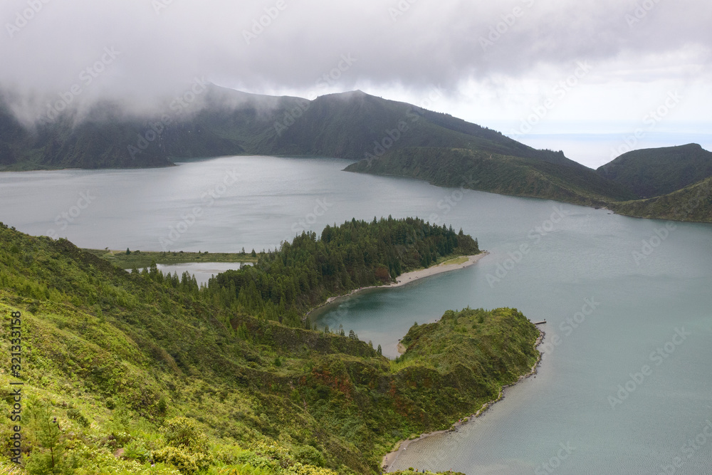The beautiful crater of Lake Lagoa do Fogo in the stratovolcano Agua de Pau Massiva in the center of the island of San Miguel on the Portuguese archipelago of the Azores. Travel to the Azores.