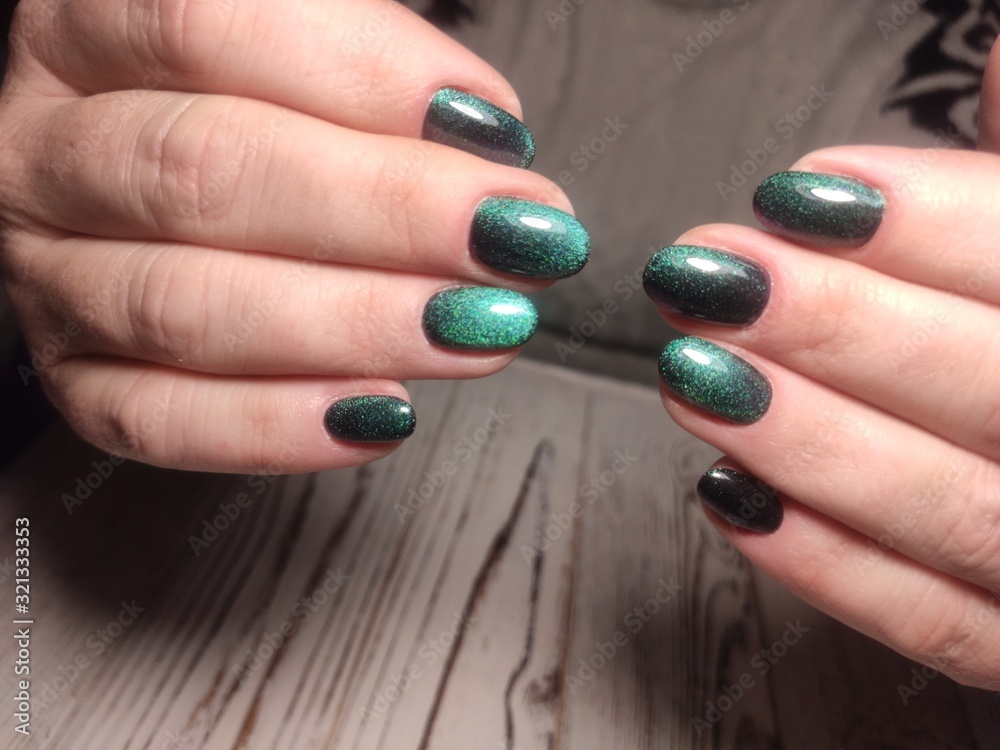 Closeup photo of a beautiful female hands with elegant manicure Closeup photo of a beautiful female hands with elegant manicure
