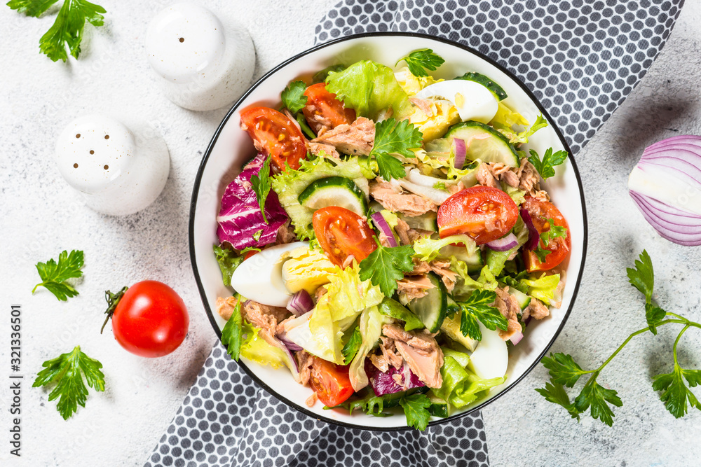 Tuna salad with green leaves, eggs and vegetables. Tuna salad with green leaves, eggs and vegetables.