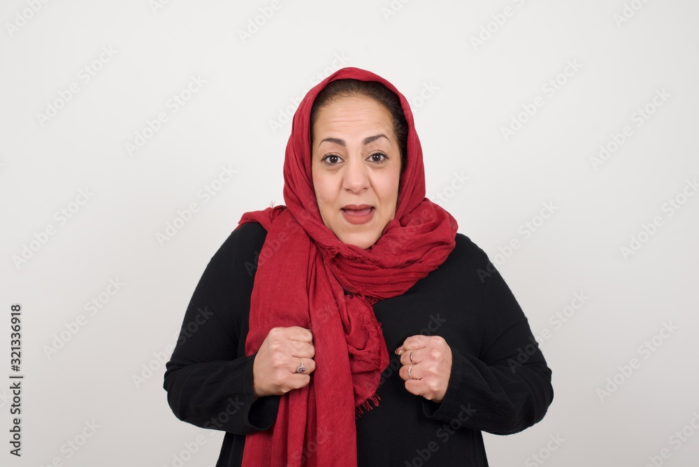 Human face expressions and emotions. Portrait of young desperate woman looking panic, holding her hands near her face, with mouth wide open. Female in despair and shock Human face expressions and emotions. Portrait of young desperate woman looking panic, holding her hands near her face, with mouth wide open. Female in despair and shock