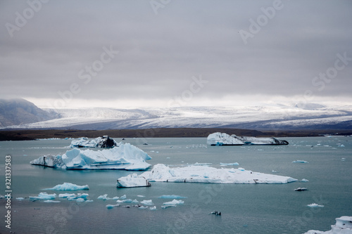 Icebergs in Jokulsarlon lagoon beneath Breidamerkurjokull glacier Sudhurland  Iceland. Place for text or advertising