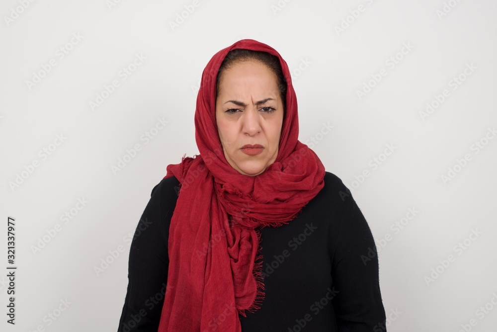 Portrait of outraged young woman with oval face, frowning her eyebrows being displeased with something. Portrait of outraged young woman with oval face, frowning her eyebrows being displeased with something.