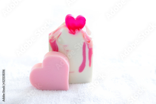 Valentine heart soaps on a white towel