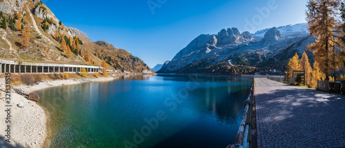 Autumn alpine Fedaia mountain Lake and Pass, Dolomites Alps, Italy.