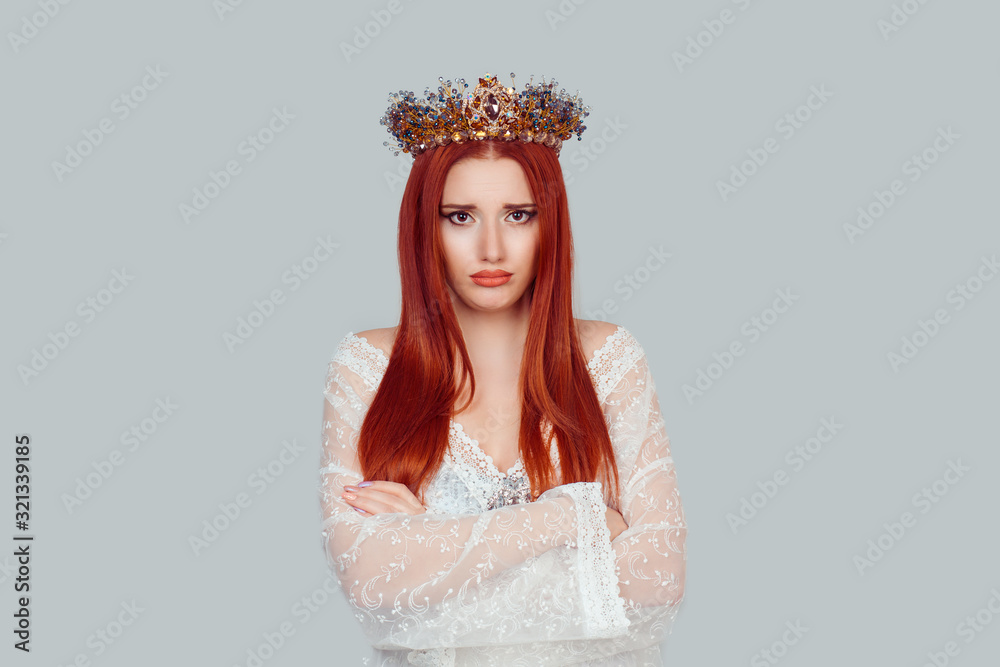 Portrait upset beauty queen, woman looking suspicious, disapproval on face arms crossed folded unhappy pretty woman with crystal crown on head isolated on light gray Portrait upset beauty queen, woman looking suspicious, disapproval on face arms crossed folded unhappy pretty woman with crystal crown on head isolated on light gray