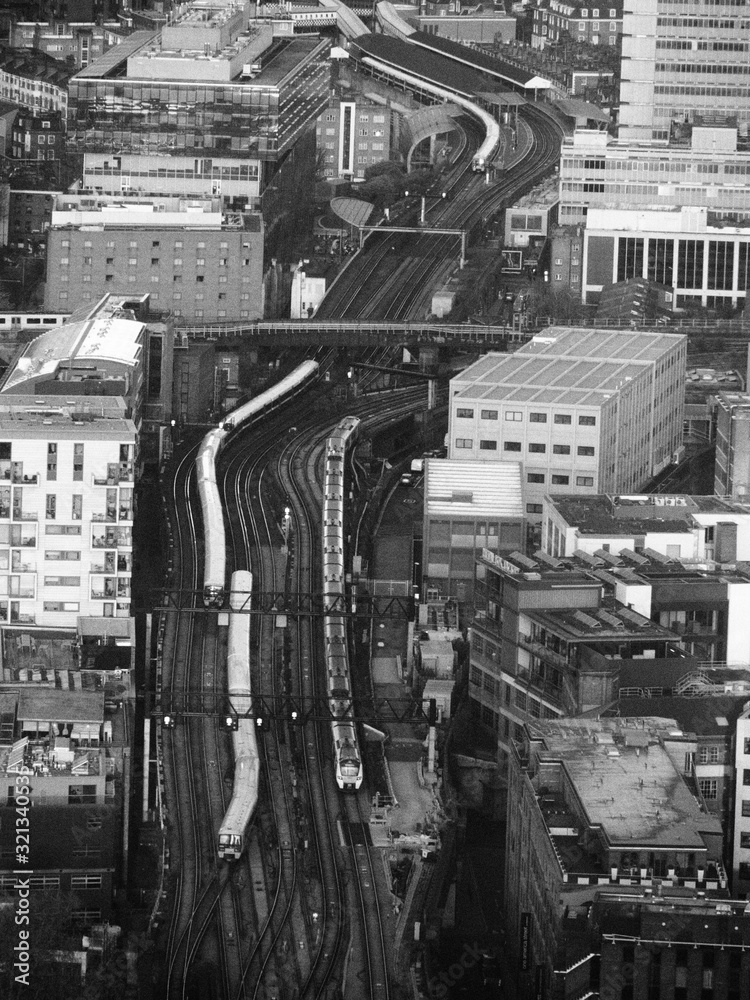 an aerial view from the Shard of the railway lines leading from Waterloo East towards London Bridge station in monochrome, black and white